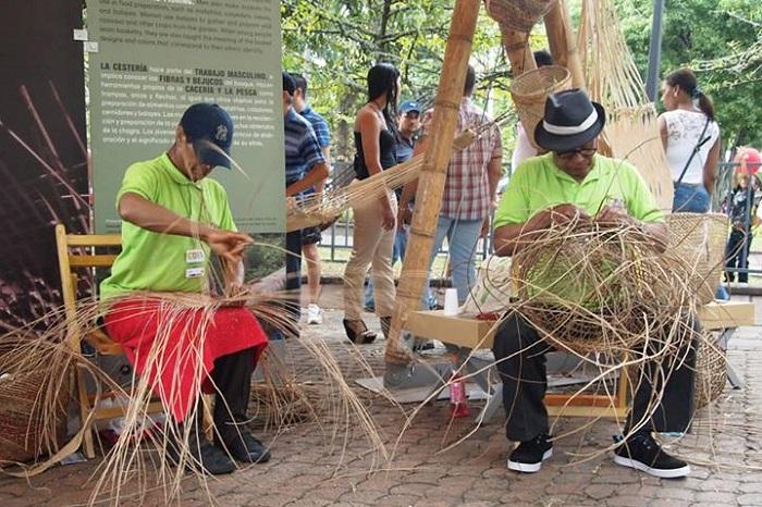 At the Cali restaging, Abel Rodríguez and Oliverio Rodríguez, from Araracuara in the Amazon region, work on their baskets. Photo by Cristina Díaz-Carrera At the Cali restaging, Abel Rodríguez and Oliverio Rodríguez, from Araracuara in the Amazon region, work on their baskets. Photo by Cristina Díaz-Carrera