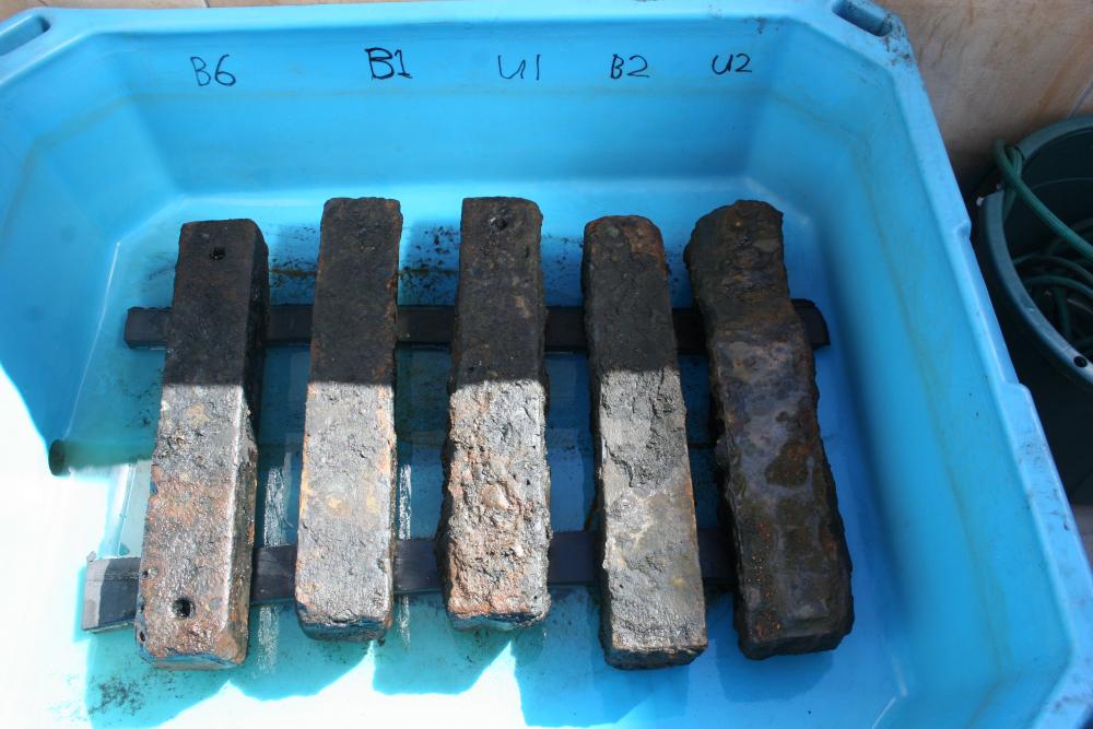 Iron ballast recovered from the São José slave shipwreck undergoing treatment. The ballast was used to weigh down the slave ship and its human cargo. Credit: Iziko Museums